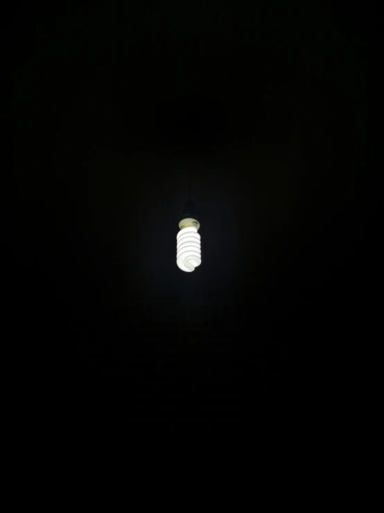 light fixture in a dark room with white light