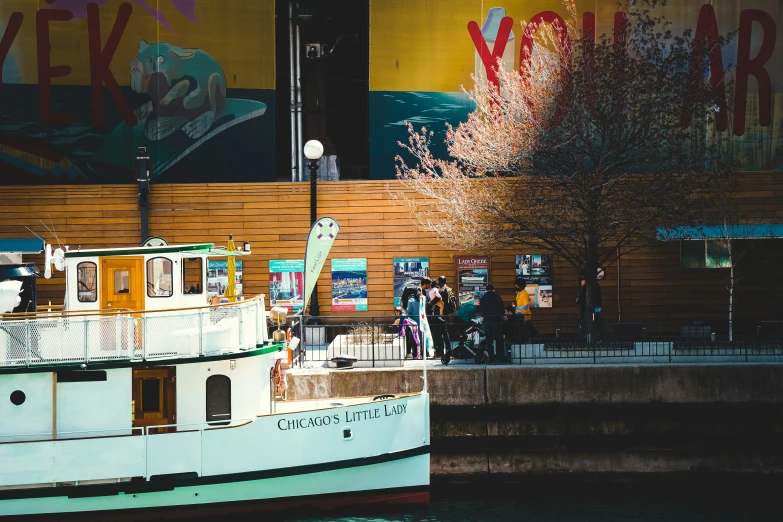 a boat on the water in front of a building