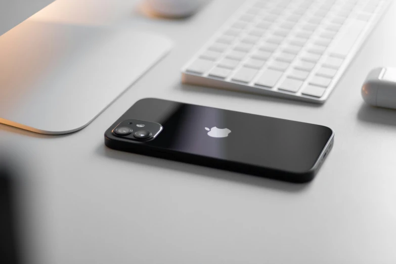 an iphone with an external battery and a keyboard