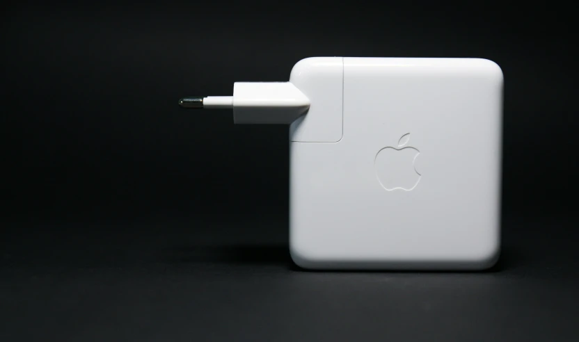 the back side of a white apple charger