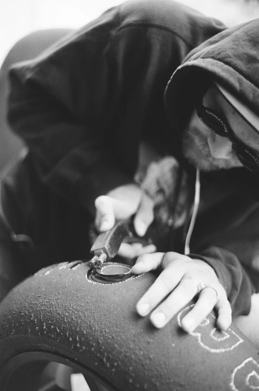 a young child is rubbing his foot with his thumb