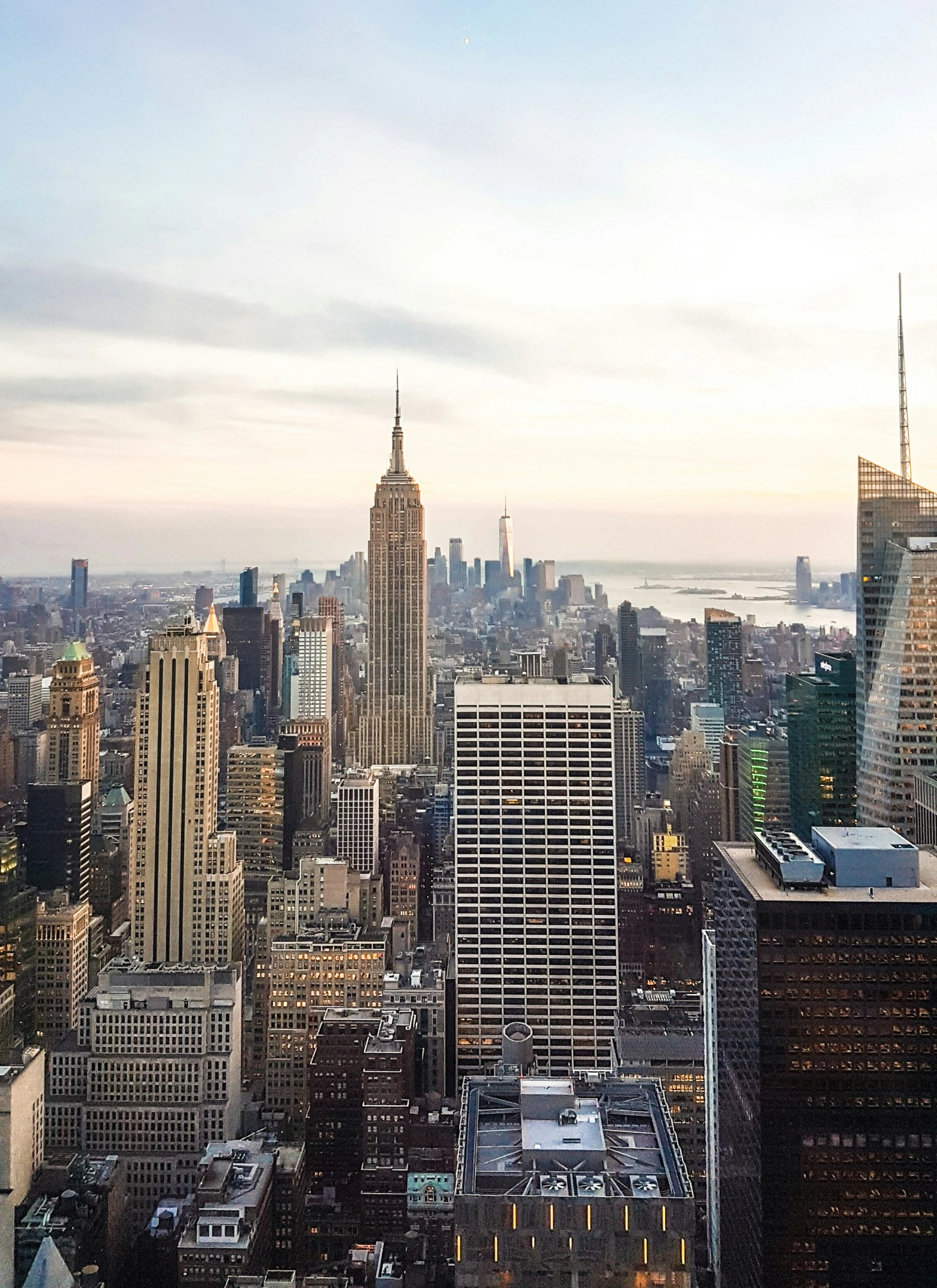 the view of downtown manhattans and skyscrs at sunset