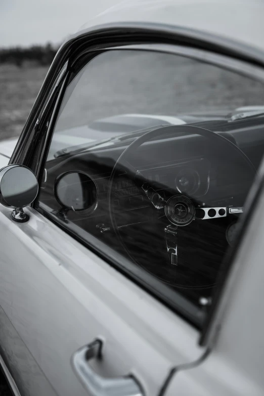 a car that is sitting by a body of water