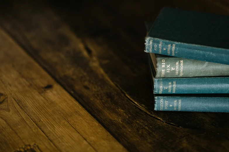 three books sitting on top of each other