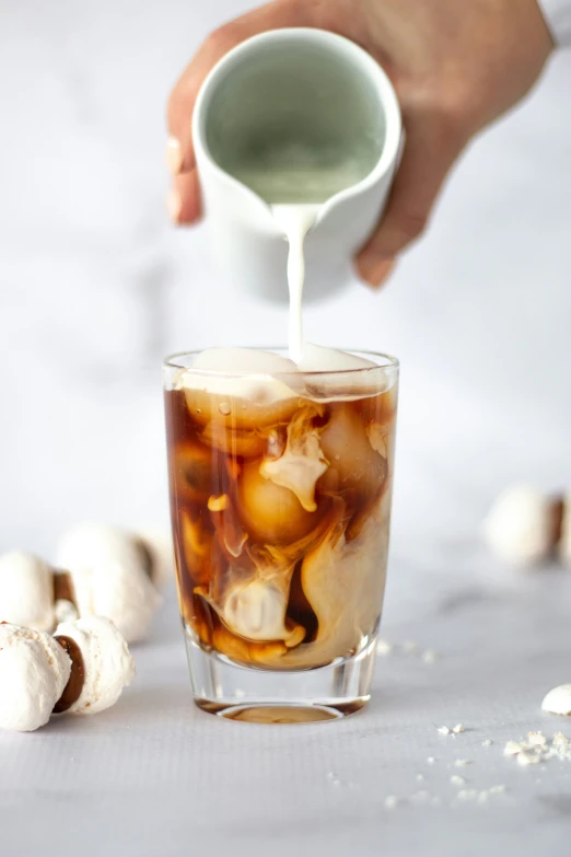 ice tea being poured into a glass