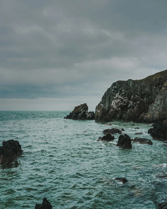 a large body of water near a rocky island