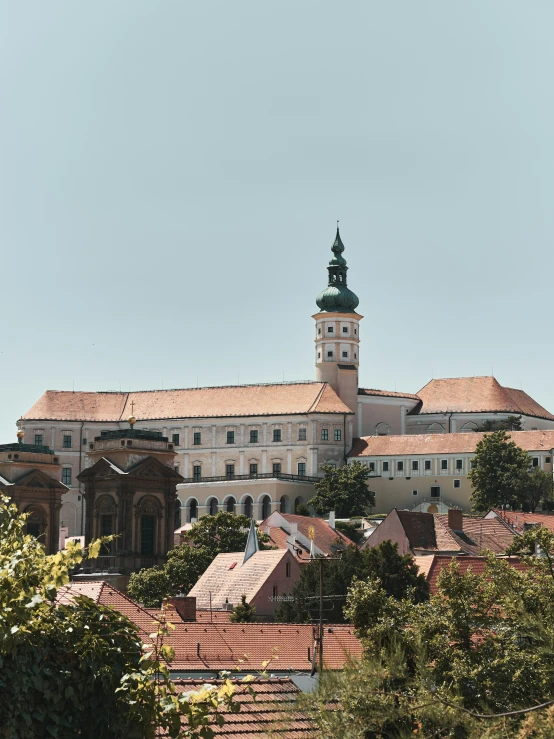 this is an ornate castle building with a clock tower and a steeple