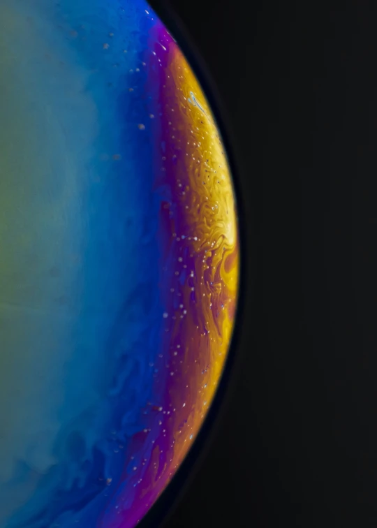 this multi - colored planet looks like it has yellow and red