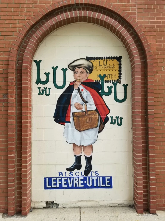 a wall with a colorful painted woman holding a brown bag