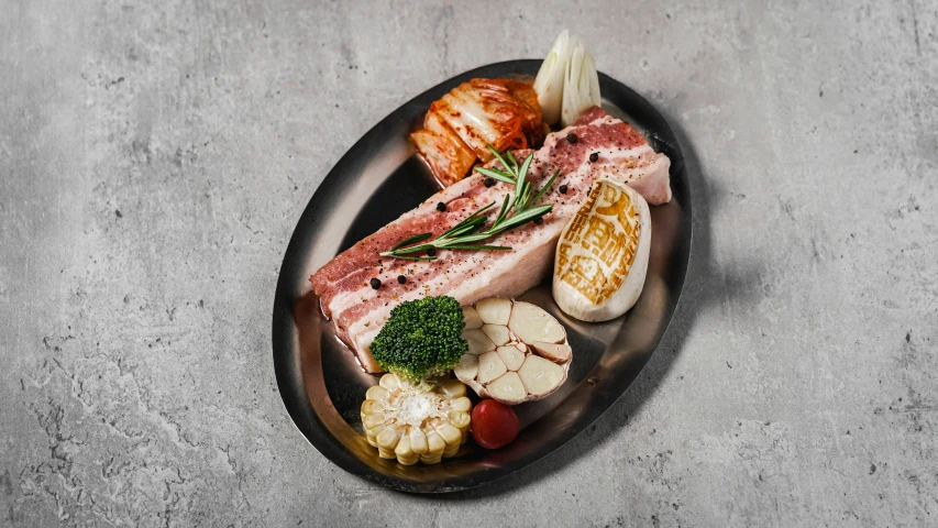 a large platter of food including steak and vegetables