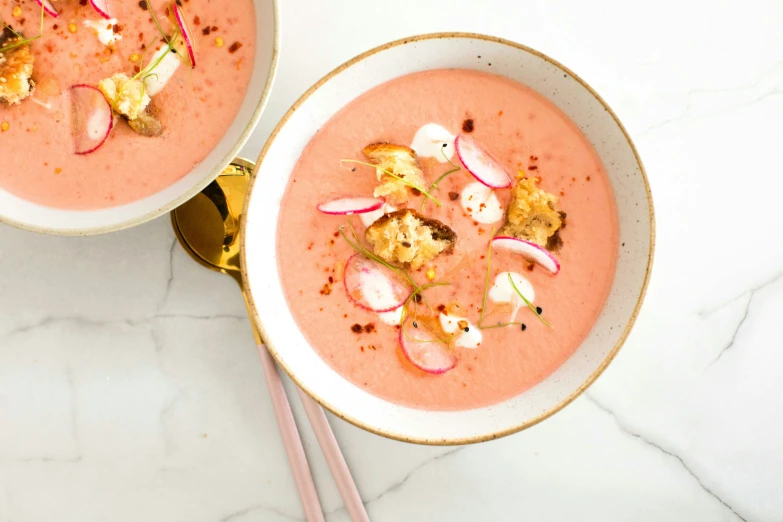 two bowls of soup and rice on a table