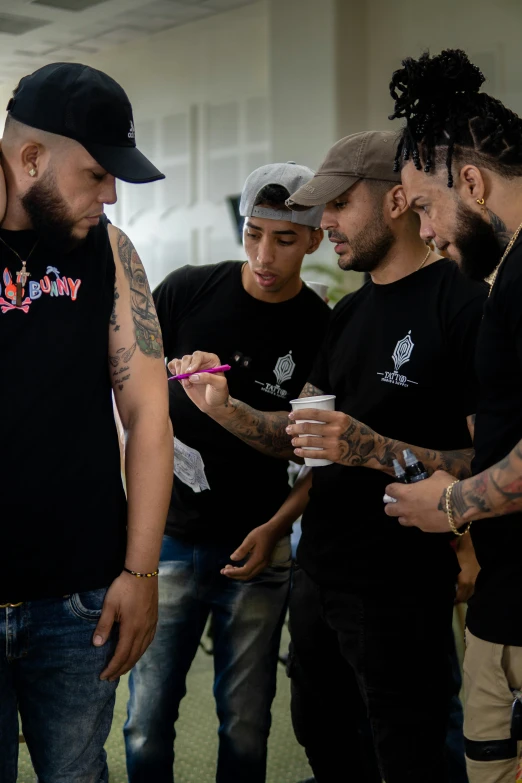 group of men standing next to each other at work