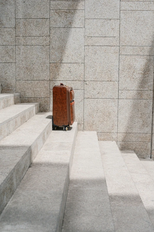 suitcase on cement steps with steps up to it