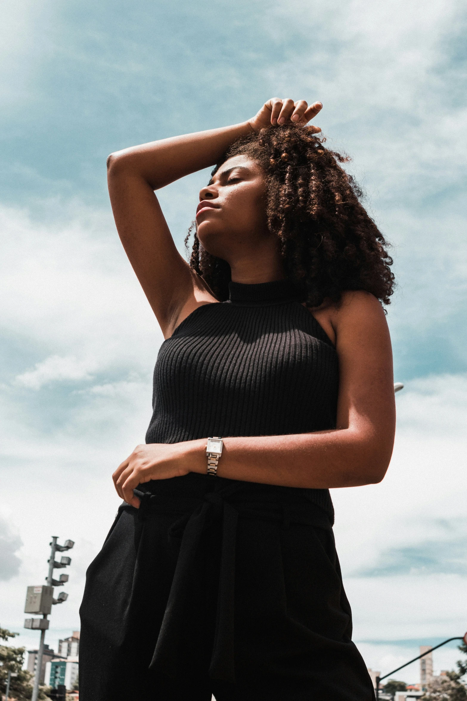 a woman is posing in front of the light