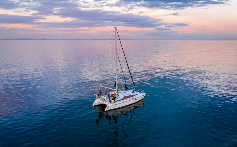 a sailboat floating on top of a large body of water