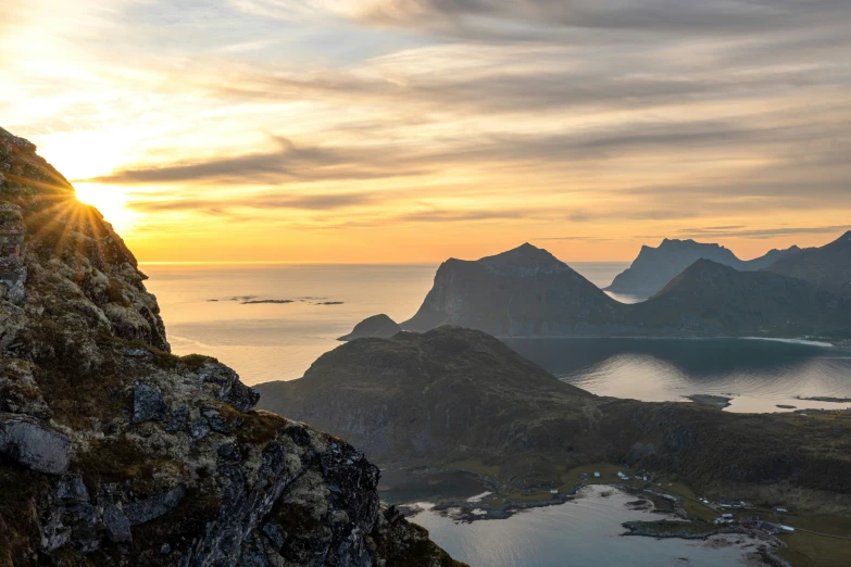 a view from a mountain with mountains in the background