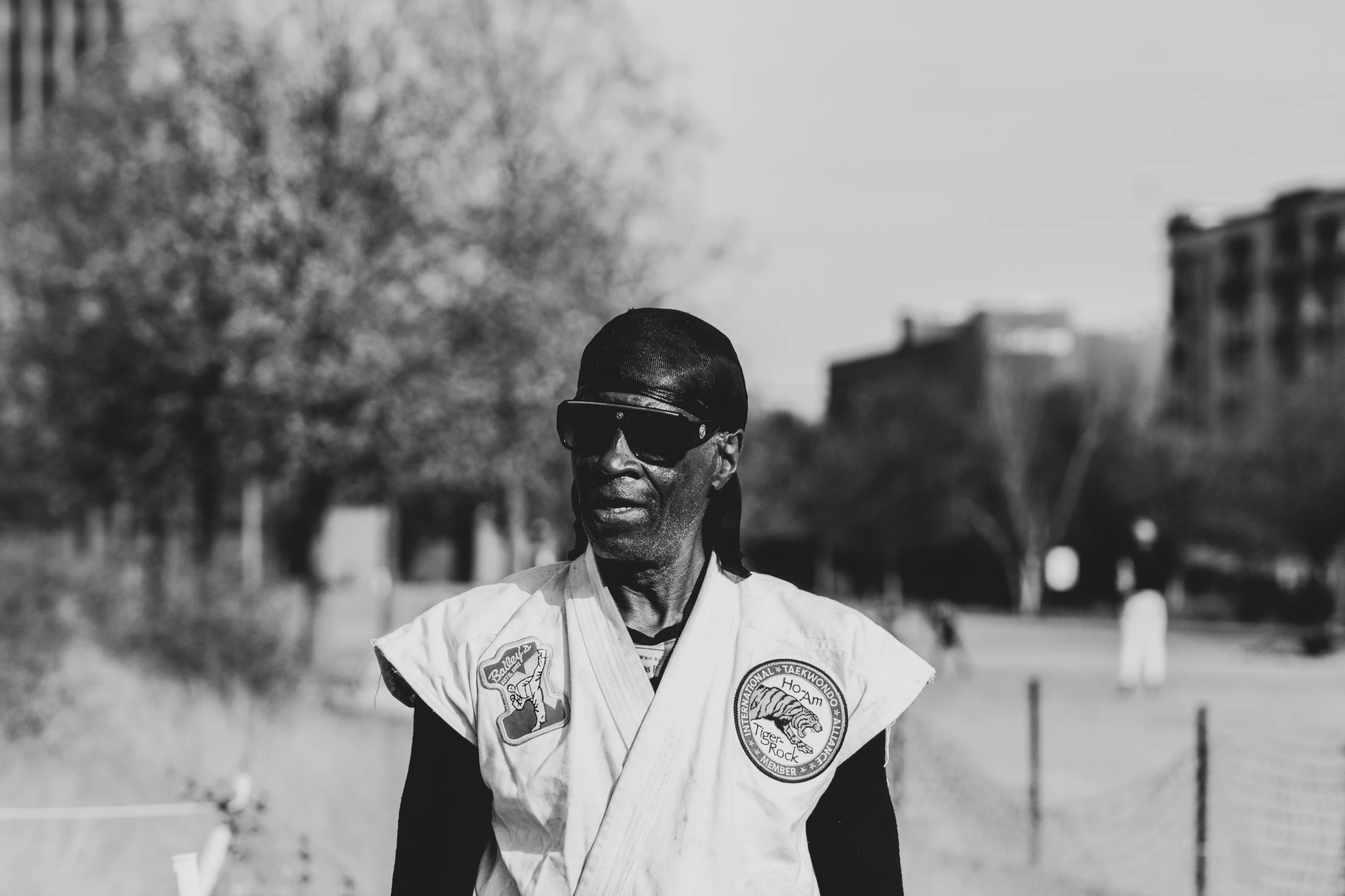 a black man wearing a uniform holding a tennis racquet