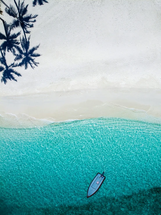 a lone blue surfboard is in the water