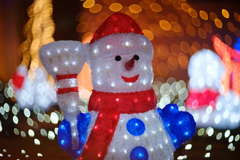 a lighted display in the shape of a snowman