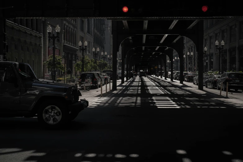 a truck traveling through a dark city street