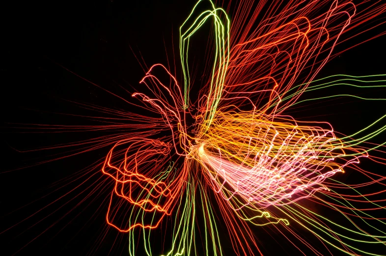 abstract bright pograph of multi colored lights in dark