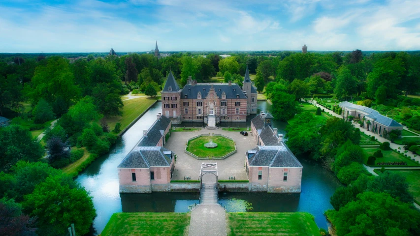 an aerial view of a castle with gardens