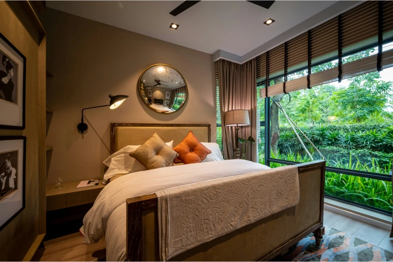 a bedroom with a view out to the trees outside