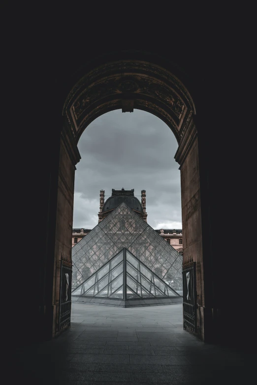 this is an arch in a building with the stairs down