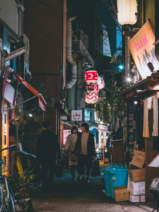 a view of people walking down an alley