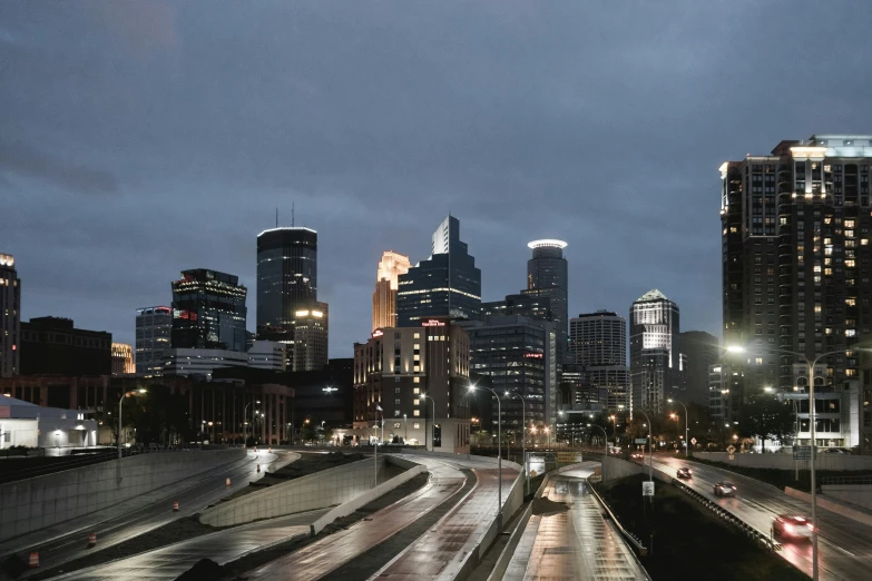 a bunch of tall buildings on the side of a road