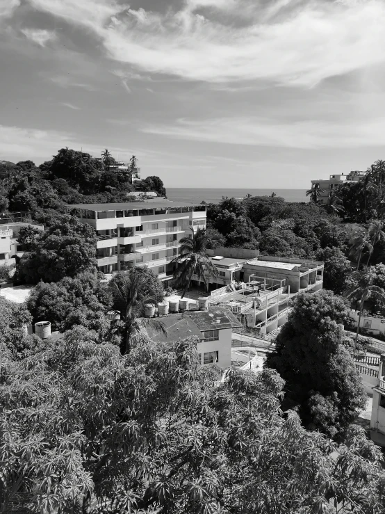 a large building surrounded by trees and buildings