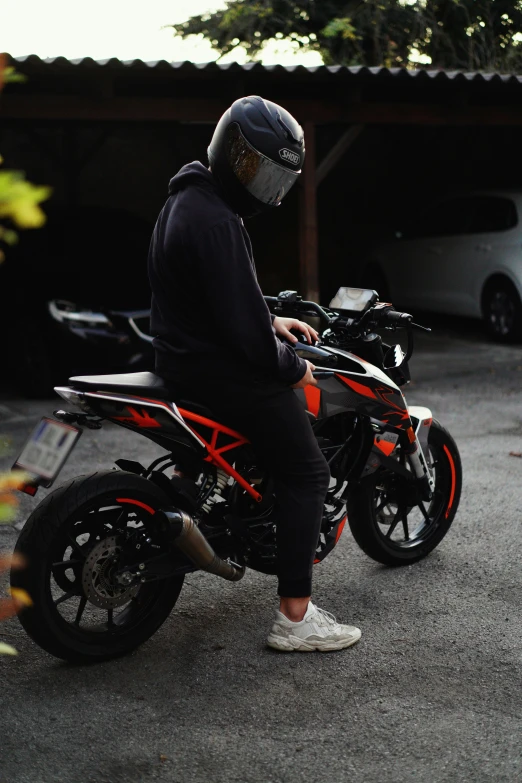 the man in helmet sits on a bike