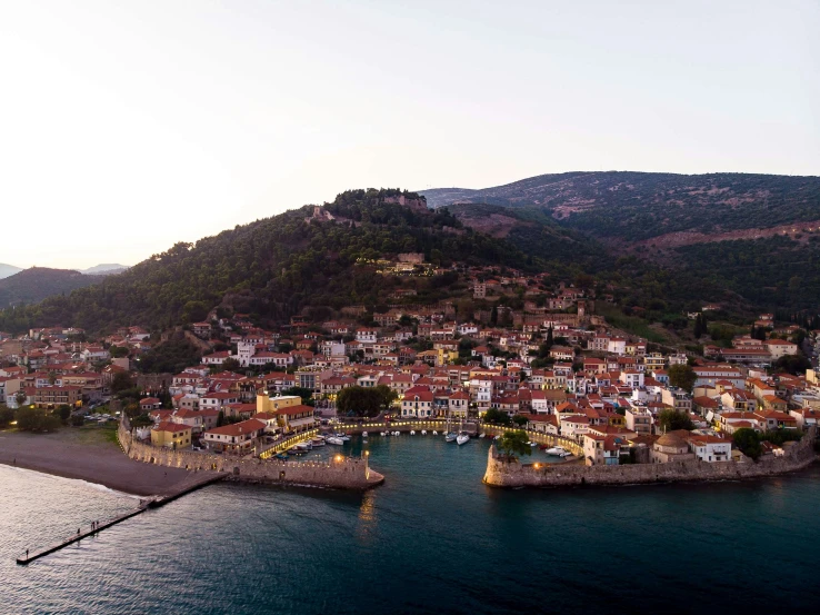 this aerial po shows small town on a large hill