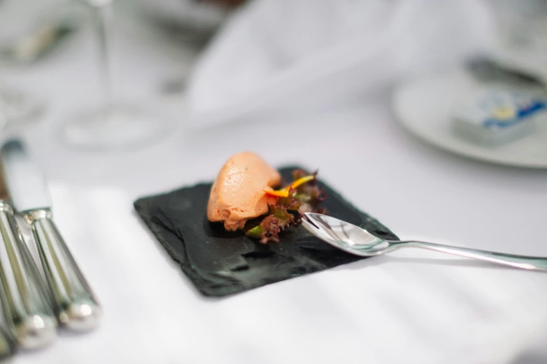 a knife is sitting on top of a plate that has food on it