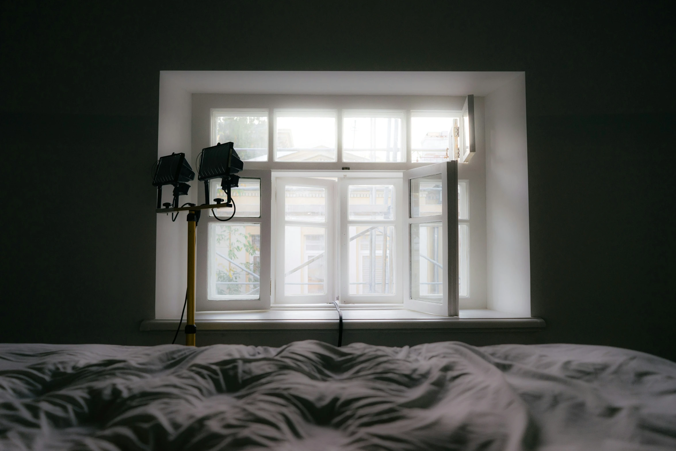 a bed is covered with fluffy white pillows