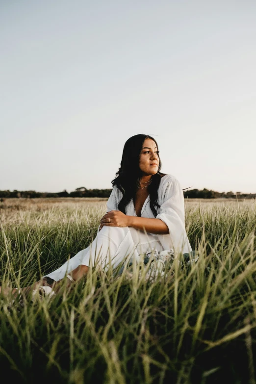 a woman is in the middle of the field