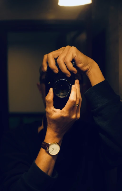 a person holding up a camera to take a picture