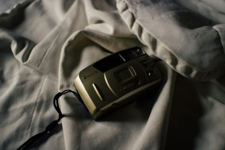 a cell phone is sitting on the bed