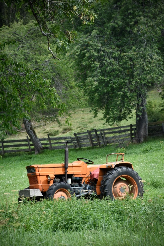 a tractor in the middle of an empty field