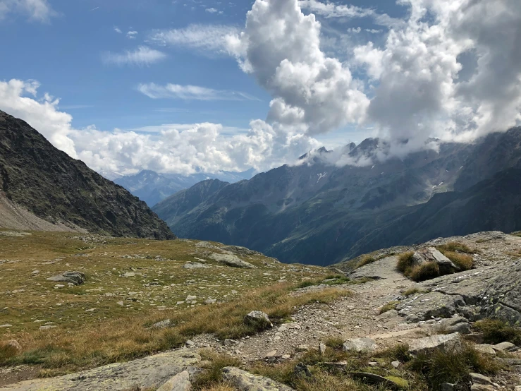 a valley that is surrounded by mountains and rocks