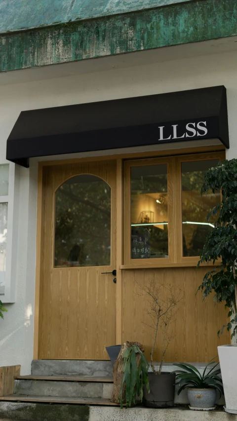 a building with a wood door and window on the outside