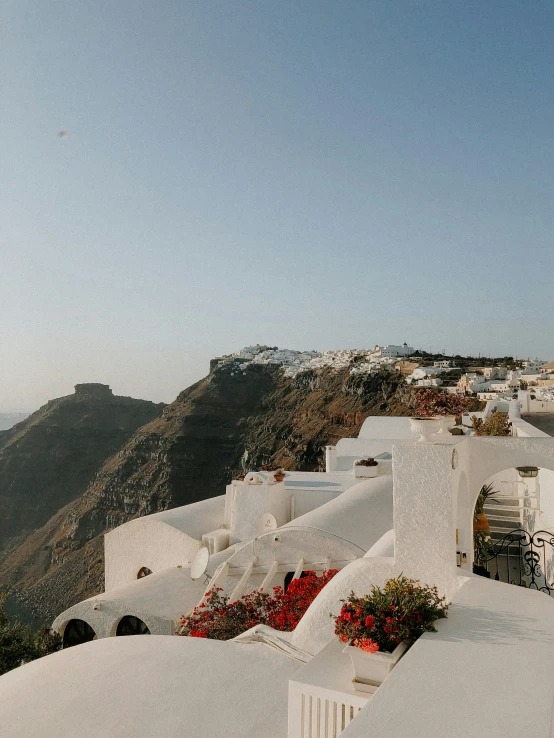 a group of white buildings sitting on top of a hill