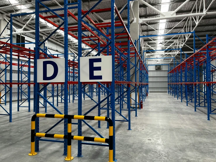 a large warehouse has a large sign in the middle