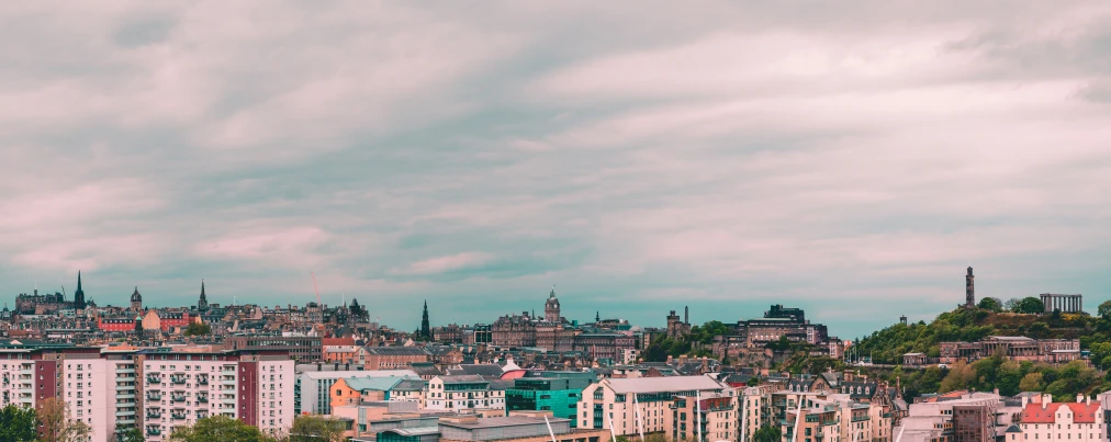 a group of buildings are below an overcast sky