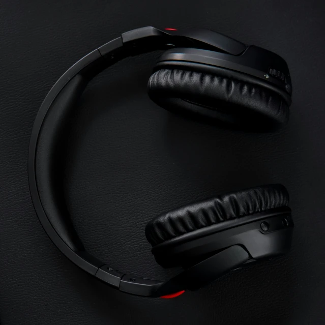 black stereo headset with red cord and cord on it