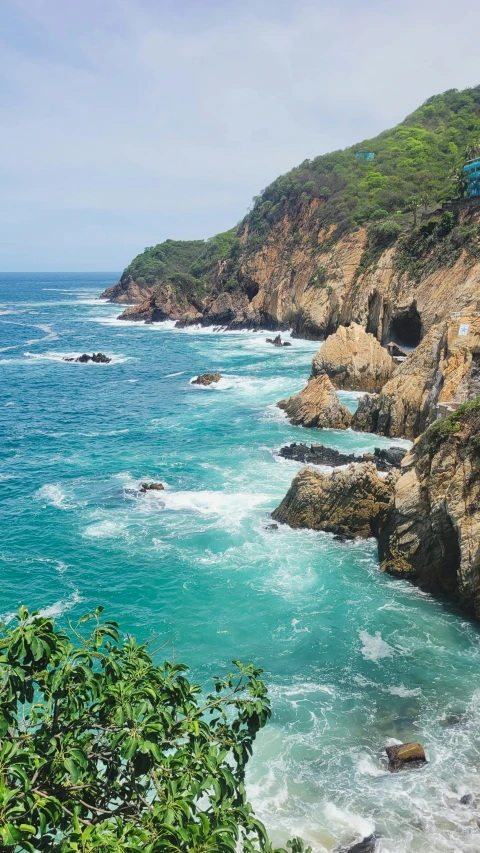 a view of a rocky beach next to the ocean