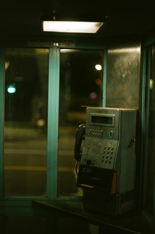 an old style parking meter is next to a building