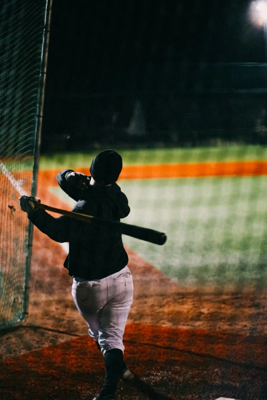 a baseball player is about to hit a ball