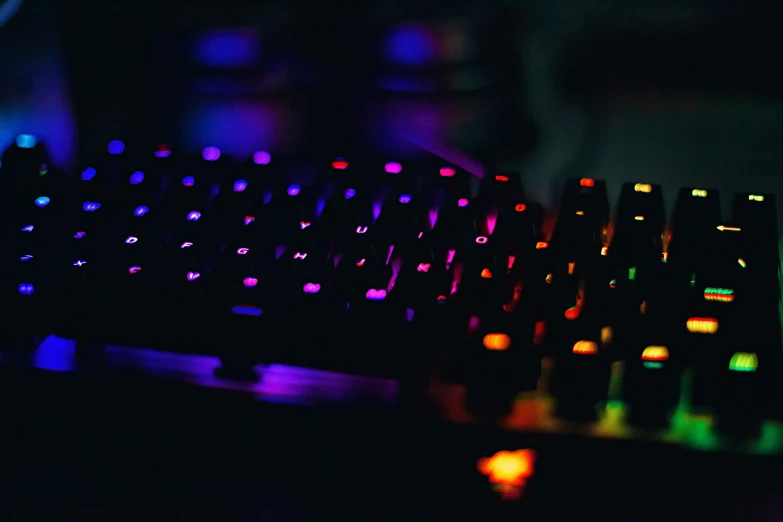 an illuminated keyboard in the dark with the light on