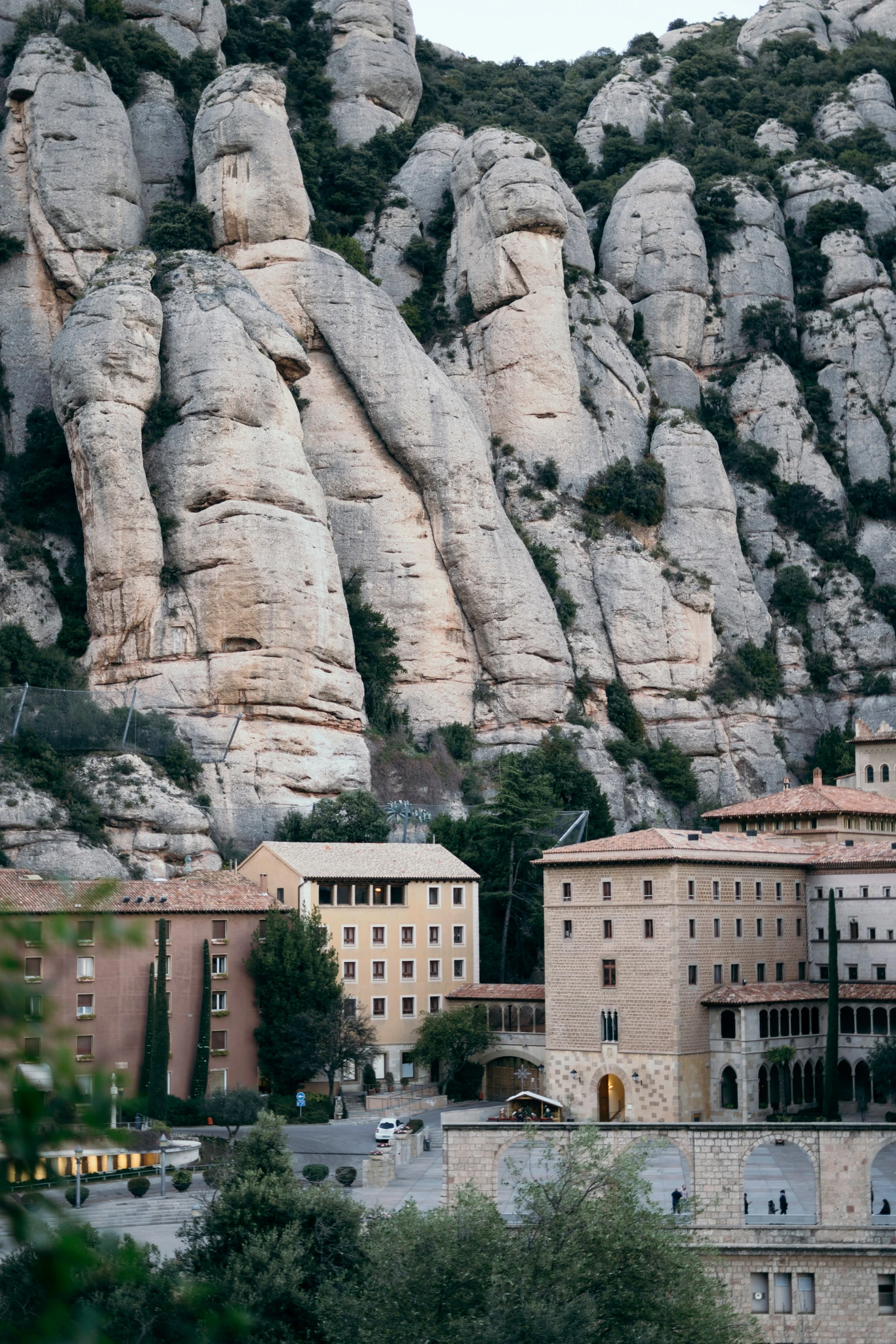 a very large rocky area next to a building in town
